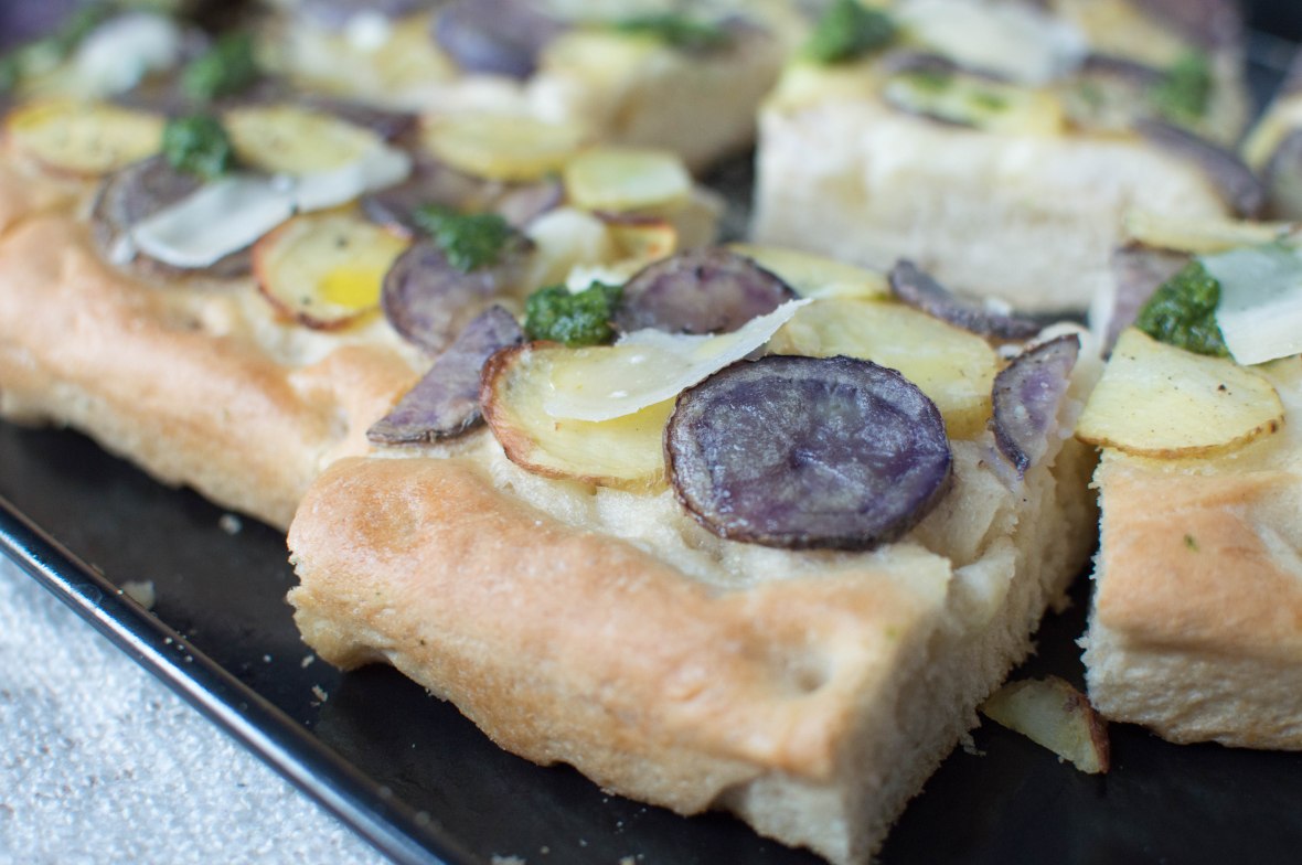 slices of focaccia with purple potatoes, kale pesto and parmesan - kay's kitchen